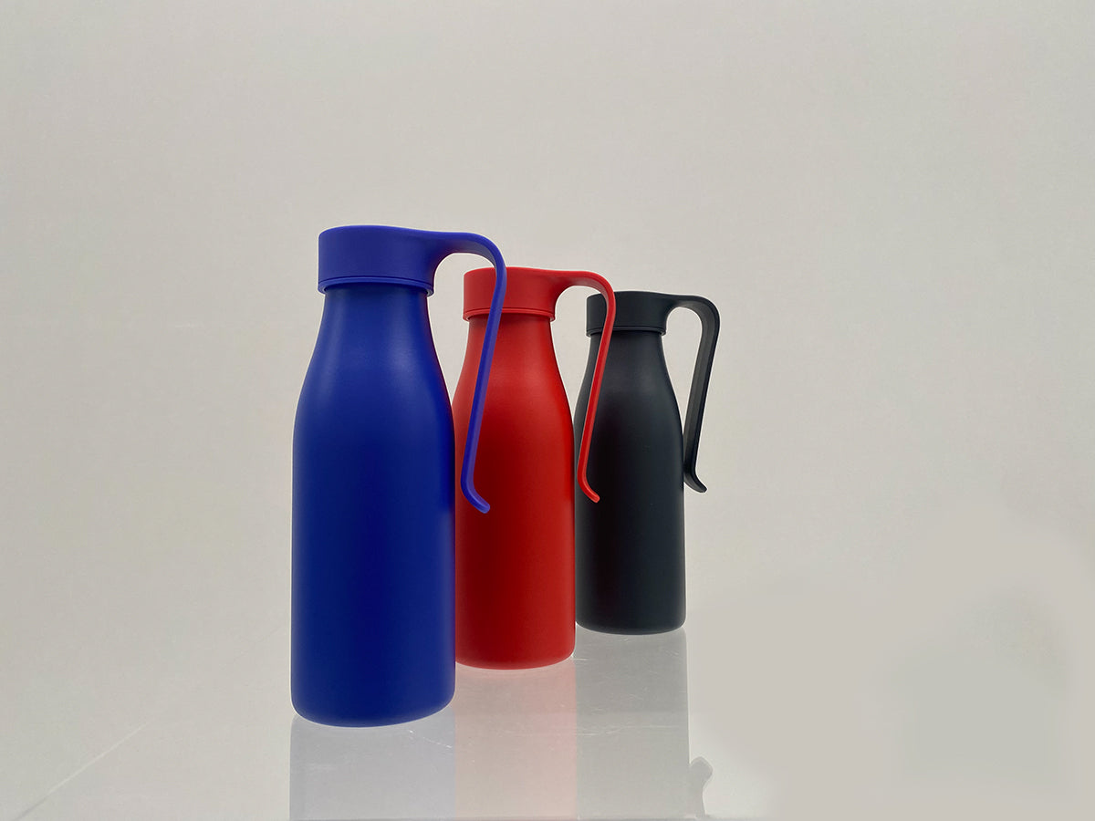 Alessi Away thermal mugs in dark blue, red and black side by side