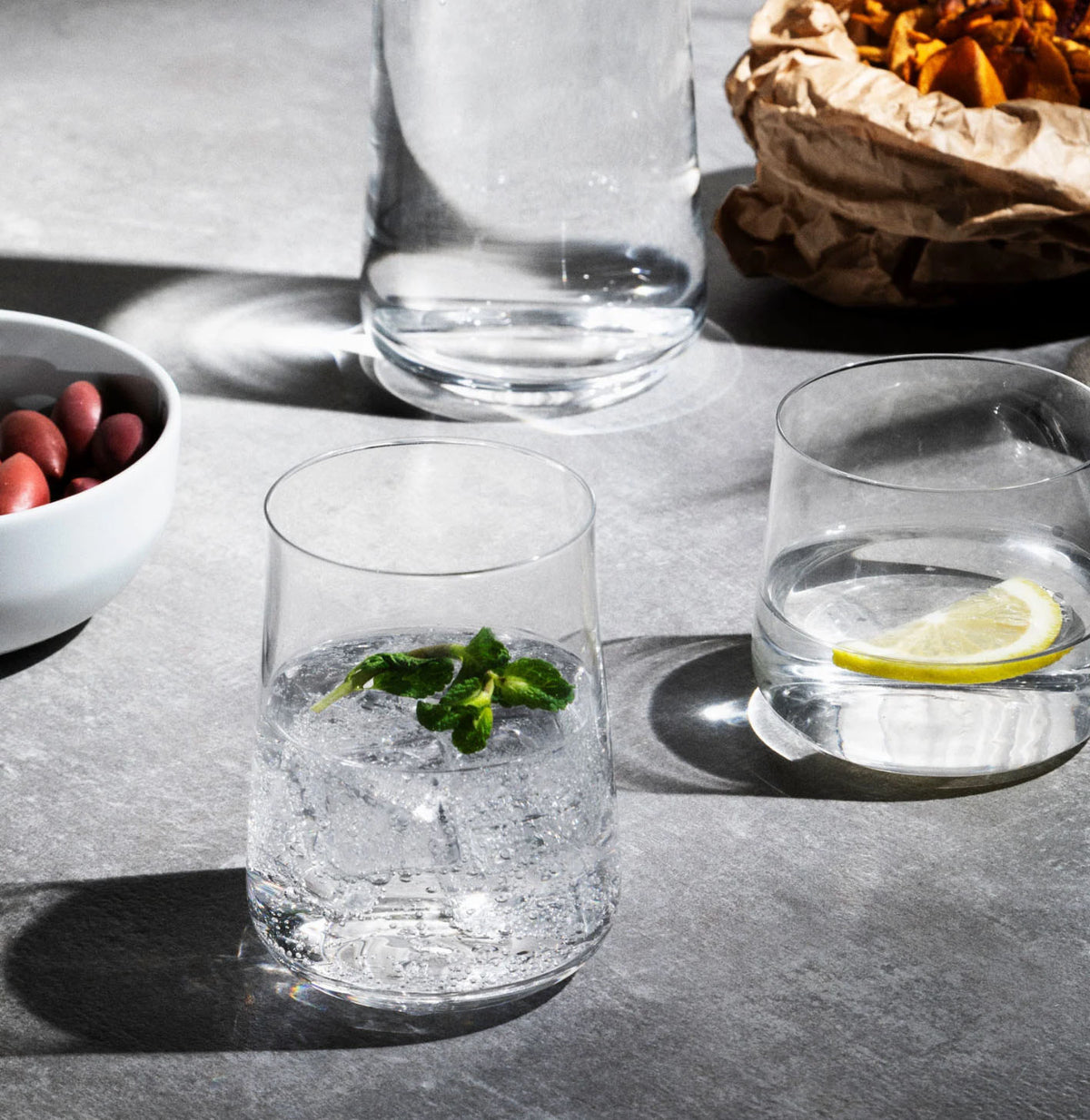 Alessi Eugenia longdrinkglas gevuld met drank en ijs