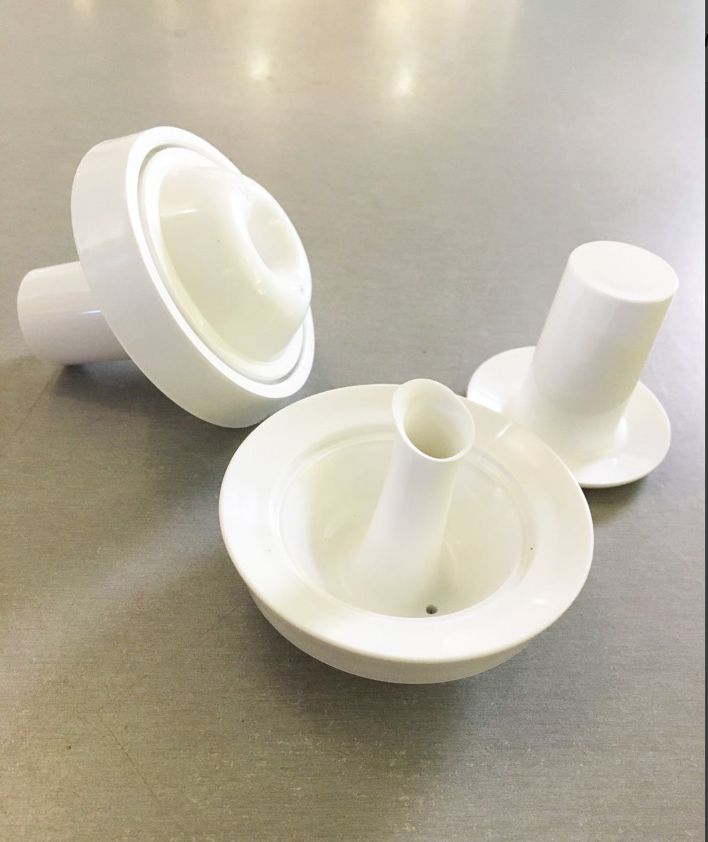 Spare cap of the Mami oil bottle, shown disassembled, in white