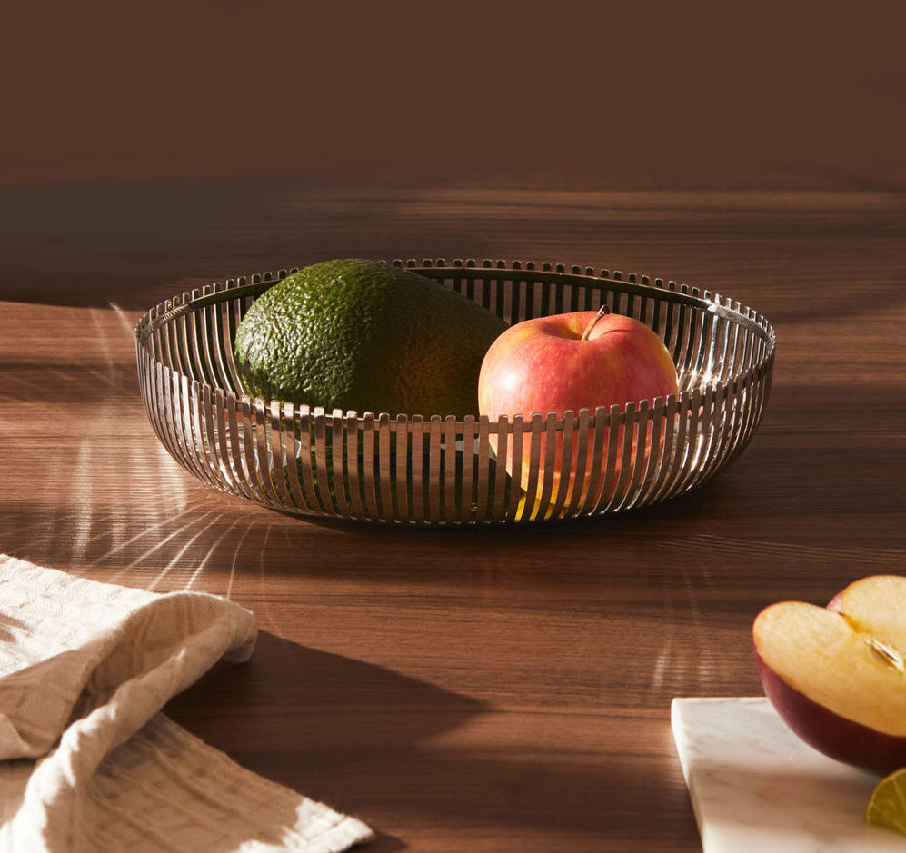Alessi Ovale low basket in stainless steel, used as fruit bowl