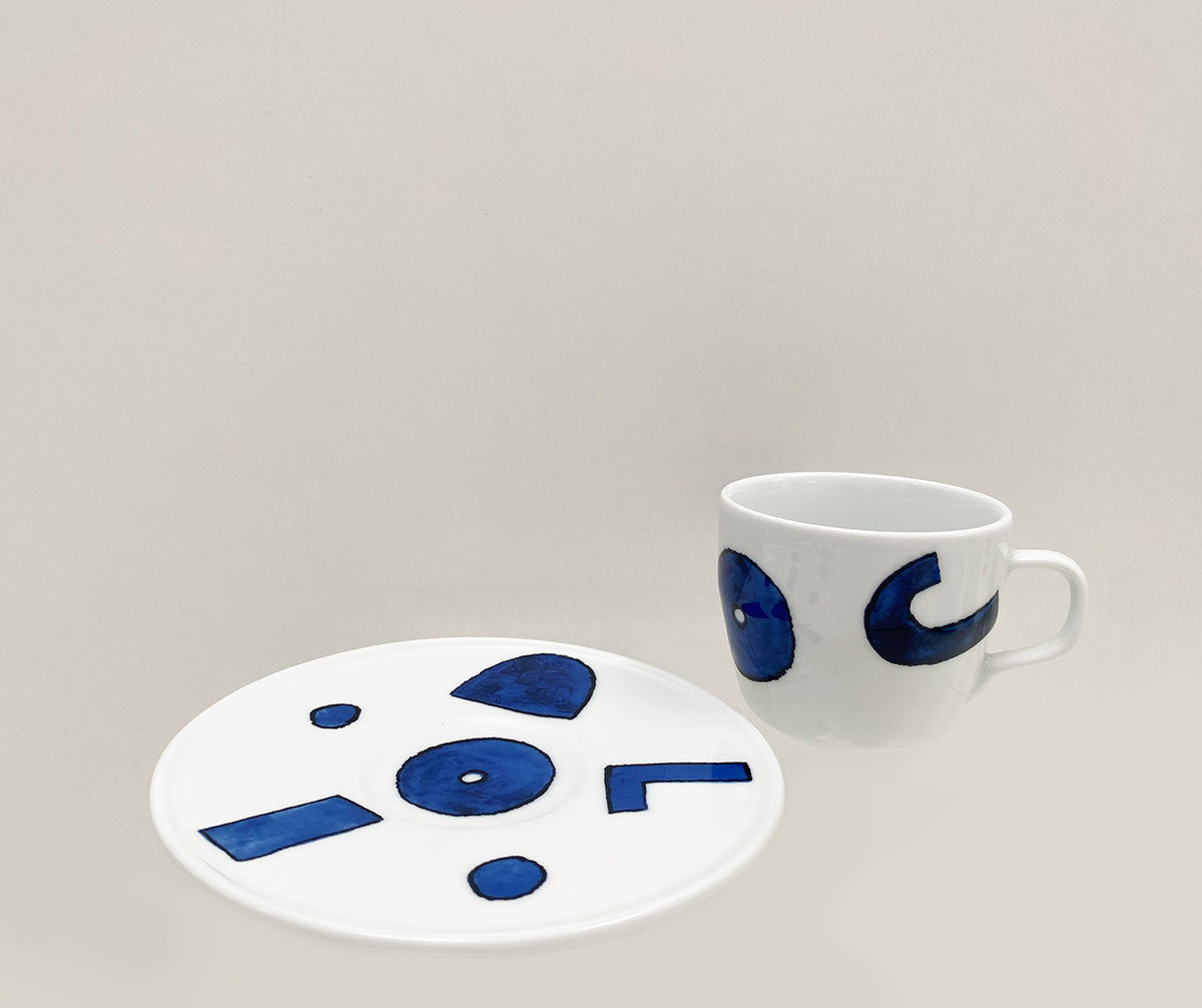 Coffee cup and saucer shown separate, Itsumo series with blue decoration