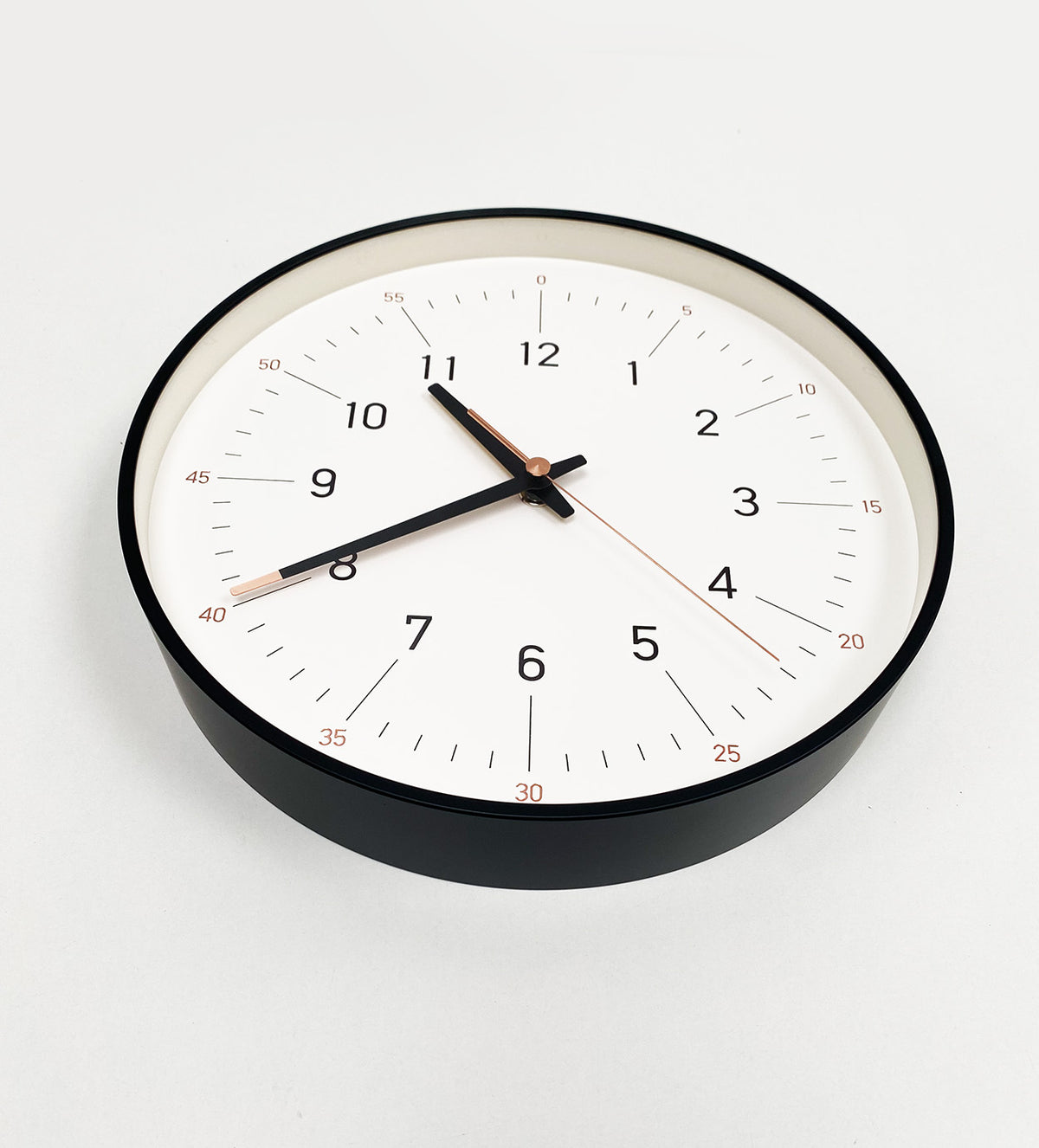 Lemnos Essence wall clock in white, at an angle