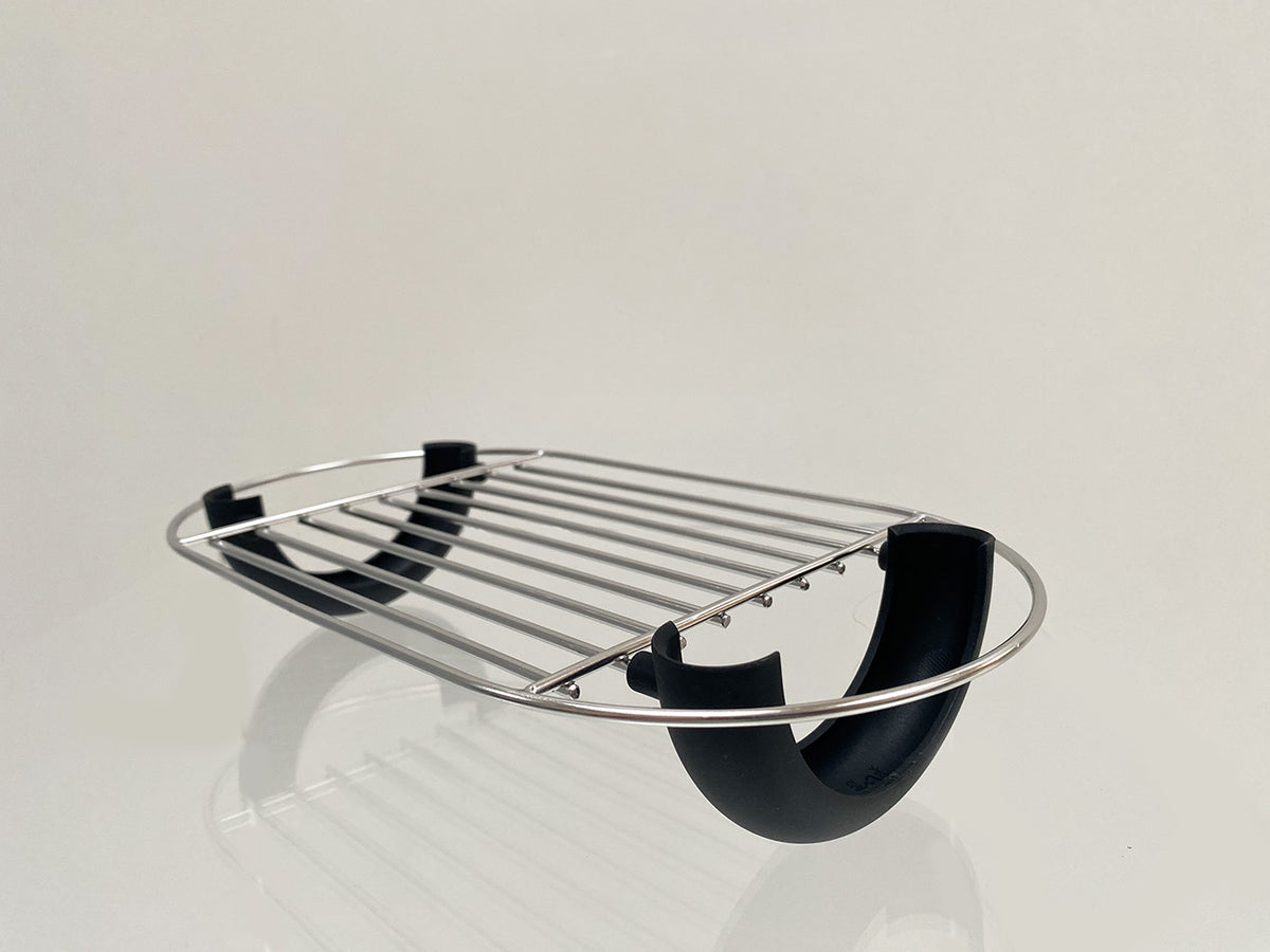 Toru bread roll rack by Alessi, side view with black holder detail