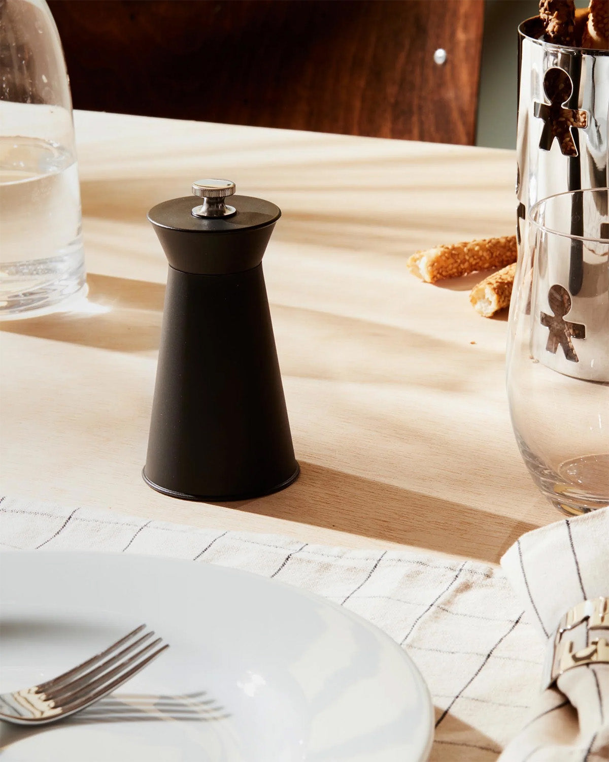 Alessi Pépé Le Moco pepper mill in black, used on table setting