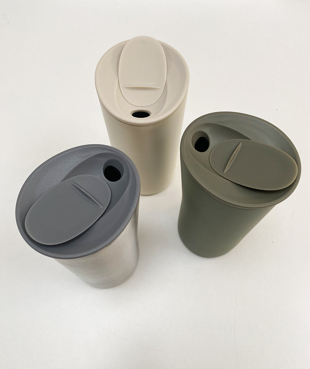 Buri thermosbekers van Alessi in grijs, wit en groen met deksels