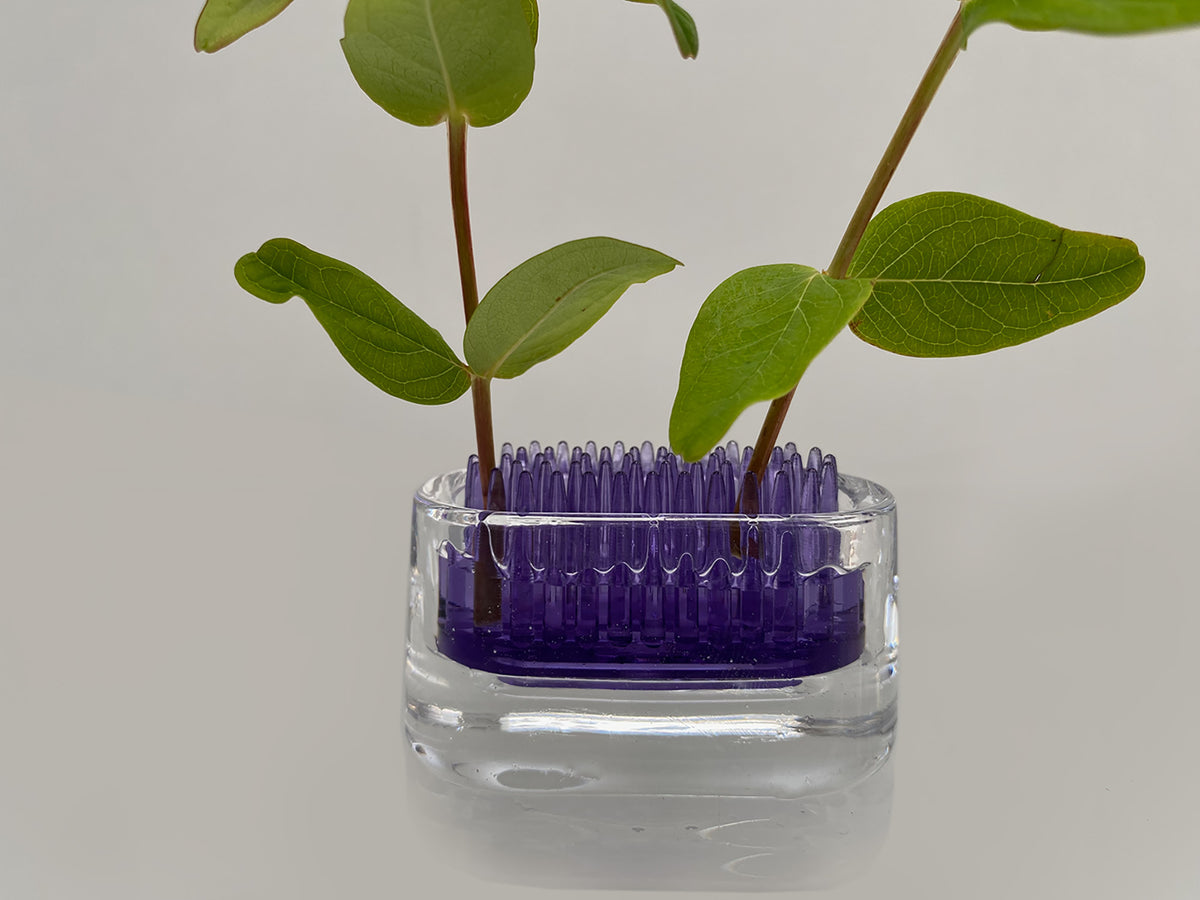 +d Michi-Kusa small glass oval vase in purple, detail of stem holder filled with water