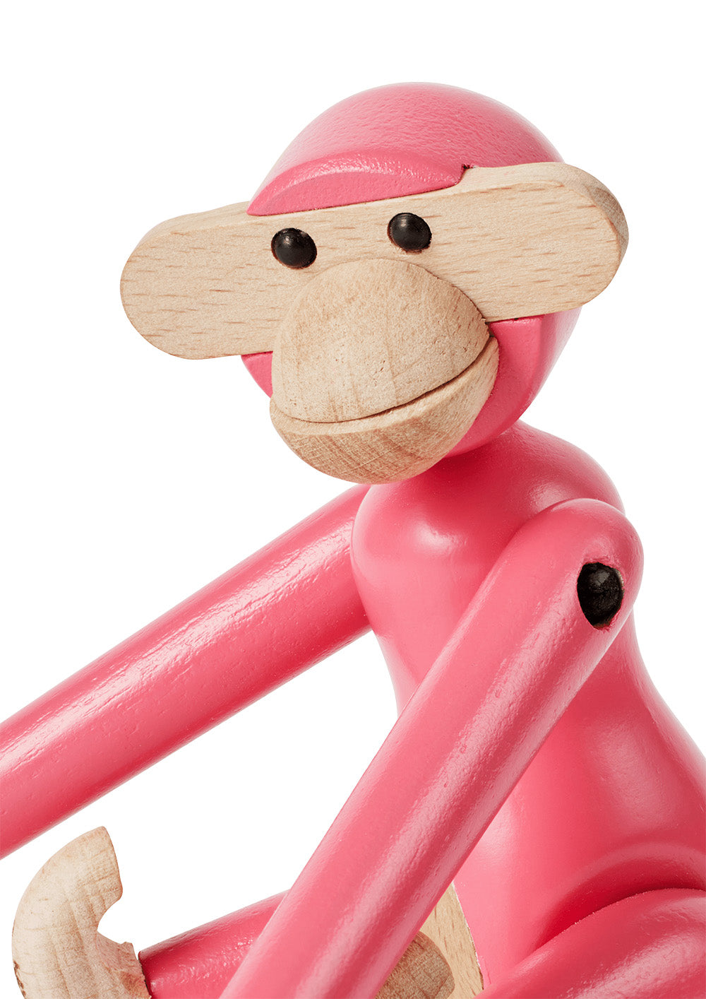 Detail van kop en arm van het roze Alessi aapje