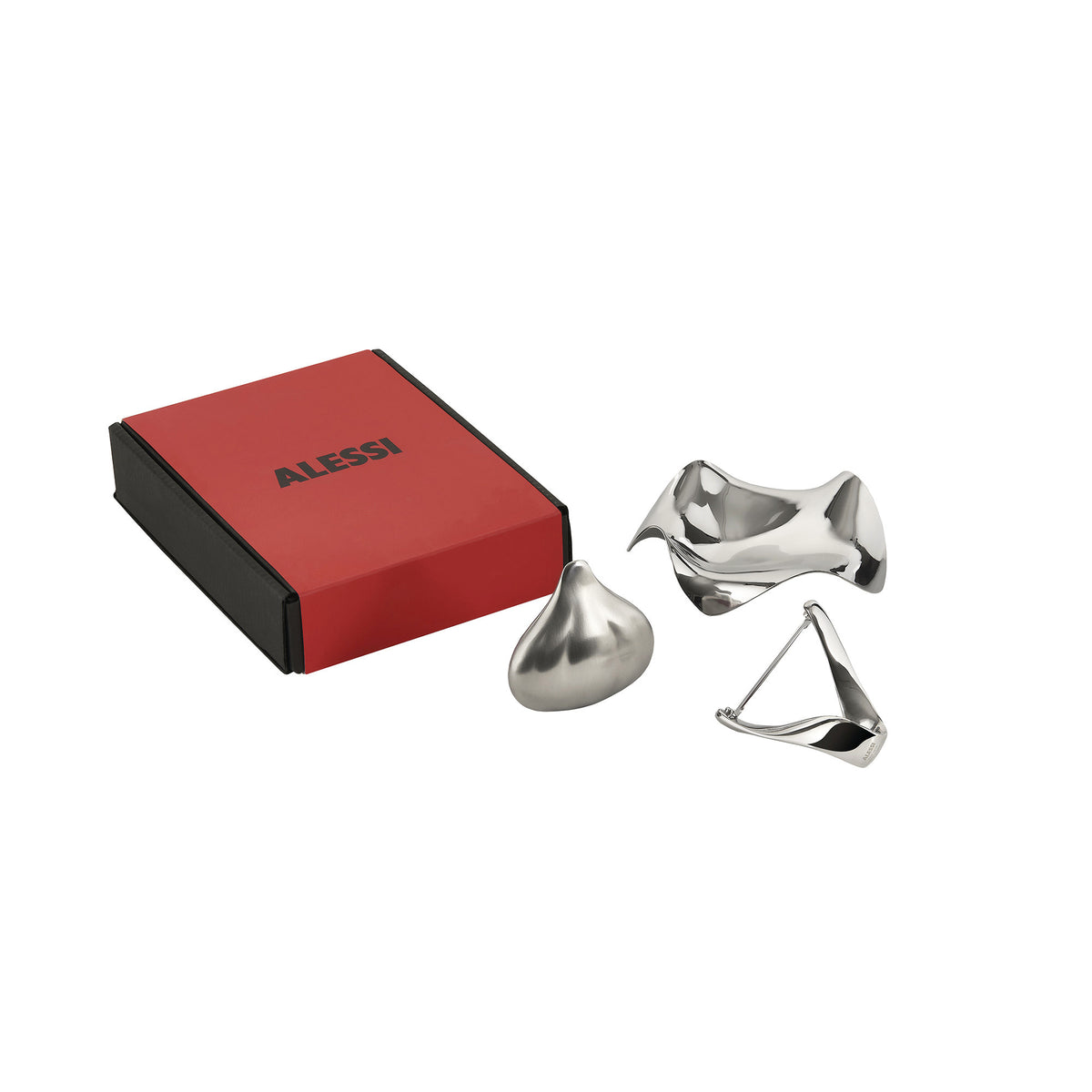 Giftset met rode geschenkdoos en drie metalen keukenhulpjes van Alessi.