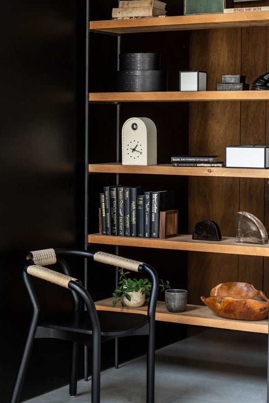 Lemnos Coo cuckoo clock in ivory, design Ryosuke Fukasada, on bookshelf