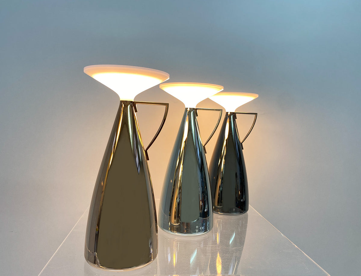 Drie Camomille tafellampen van Kartell naast elkaar, brandend