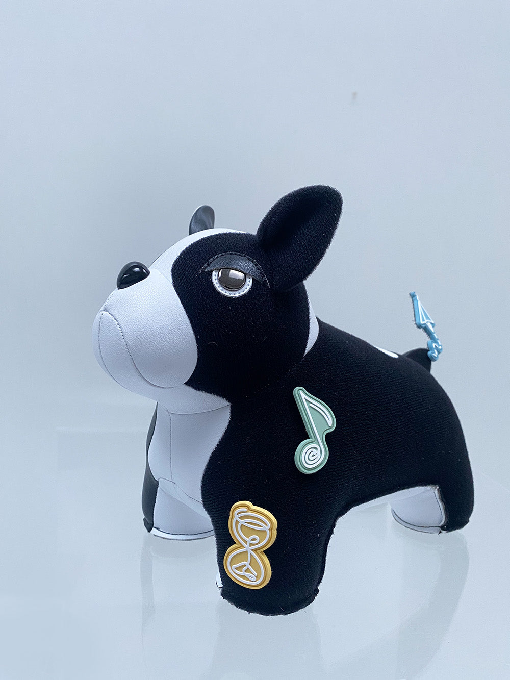 Detail of black velcro layer with three included patches on French Bulldog bookend