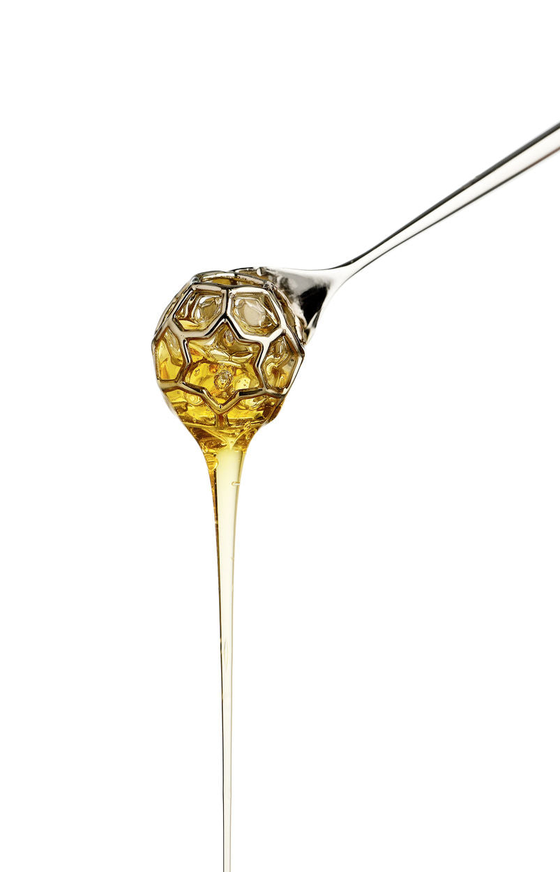 Alessi honey spoon, close-up of the bulbous end with honey