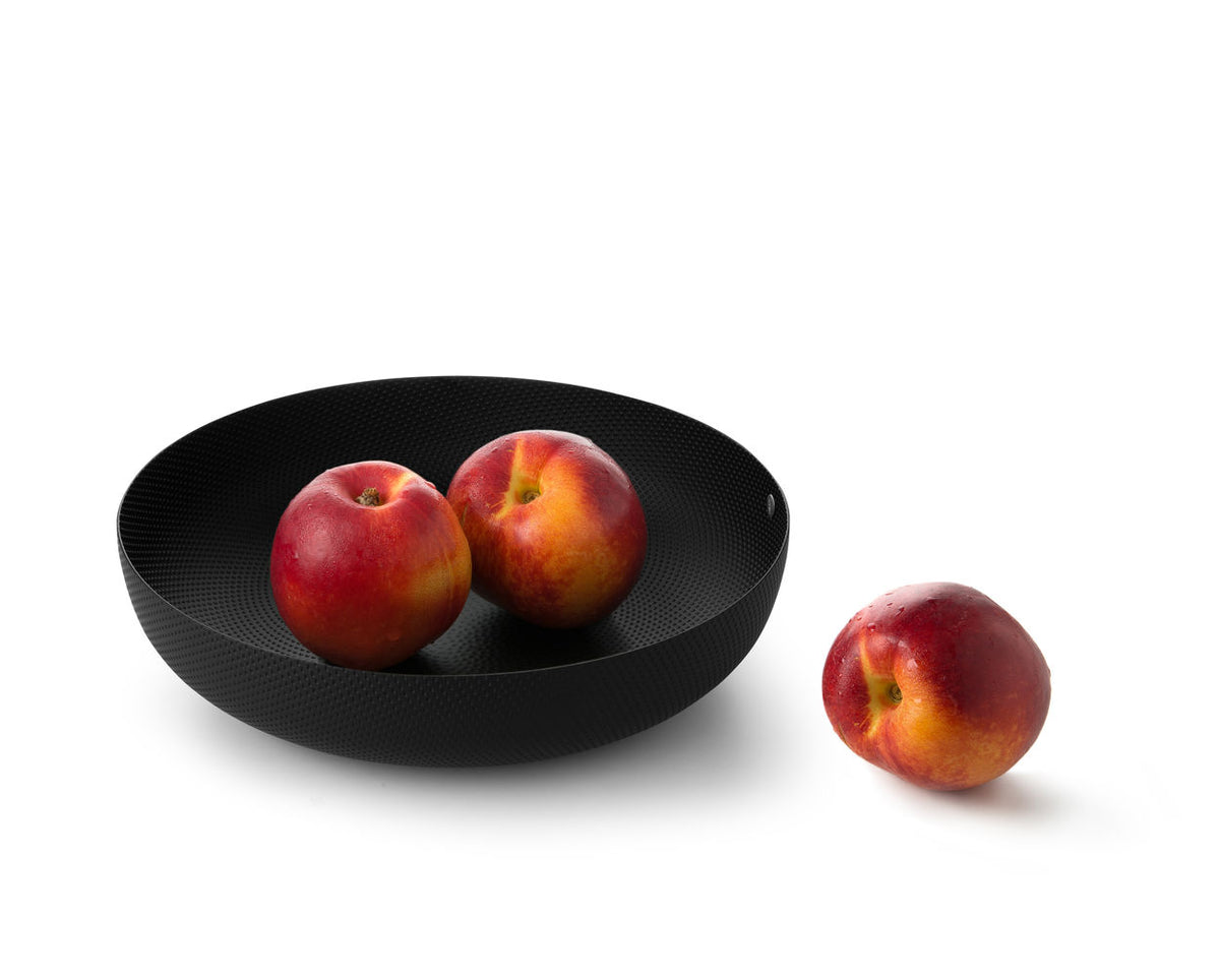 Alessi ronde mand in zwart metaal met reliëf, met fruit erin