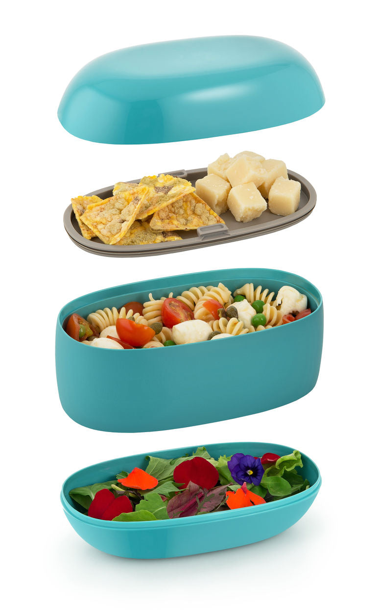 Bento-box van Alessi, uit elkaar met de losse vakken gevuld met eten