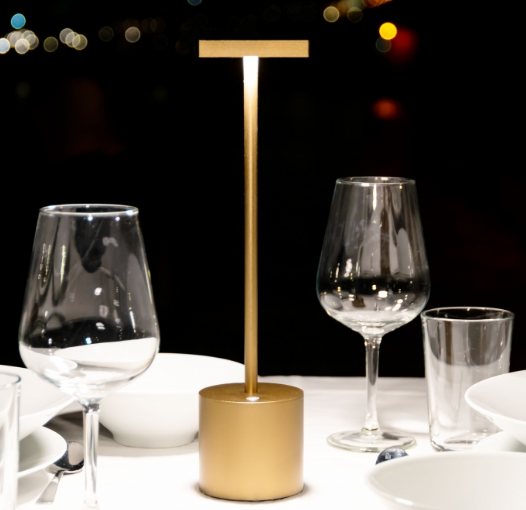 Alessi Liberty rechargeable lamp, design Michael Rösing, in gold, front view