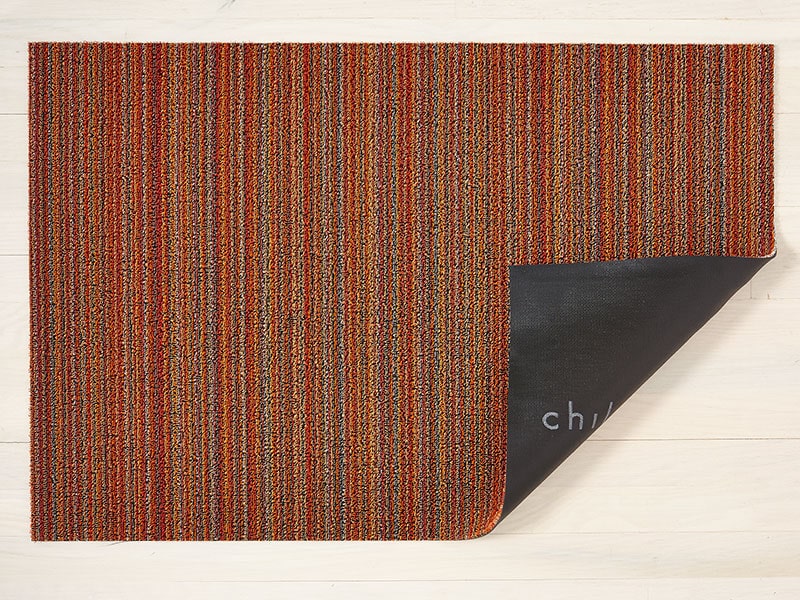 Chilewich Skinny Stripe doormat, folded corner showing vinyl backing