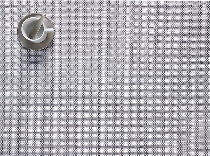 Beautiful Thatch Dove placemat by Chilewich, woven texture, with cup on top