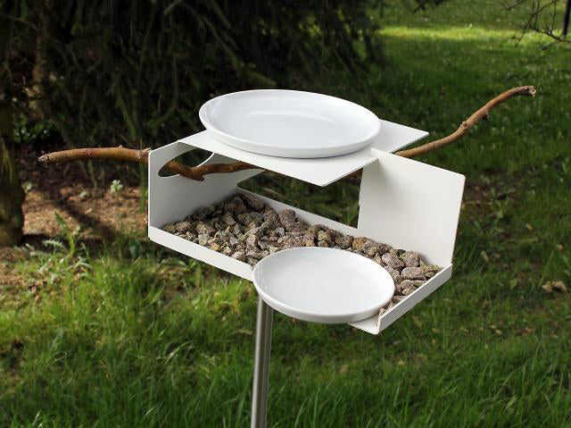 Opossum BirdBath VT-1 bird feeder outdoors on base, filled with pebbles