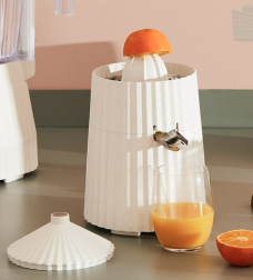 Alessi plissé citrus juicer with removable lid, separate beside it