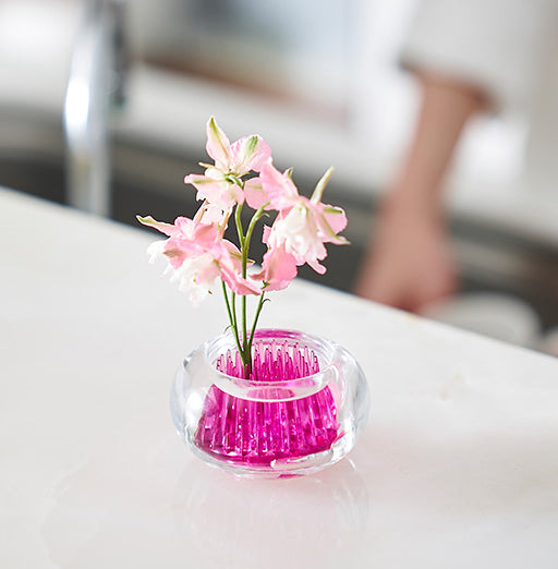 Small glass Michi-Kusa vase by +D, design Fumiaki Kono, with pink insert and floral sprigs