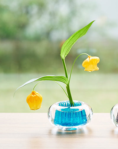 Small Michi-Kusa vase in blue glass, filled with water