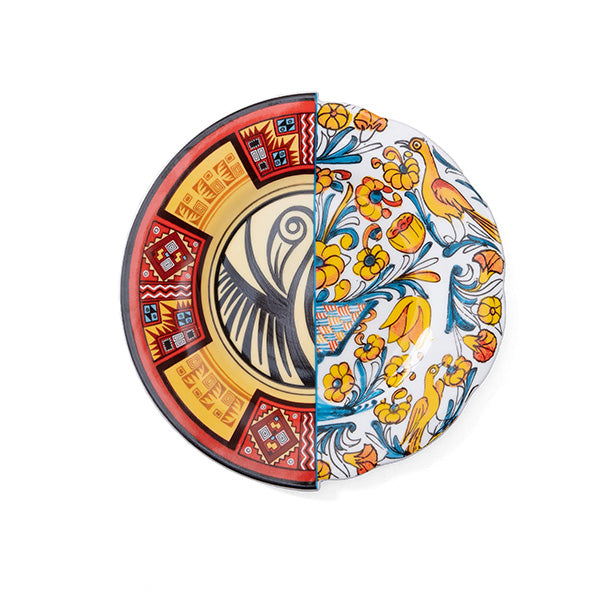 Top view of dessert plate with two halves in contrasting colourful pattern