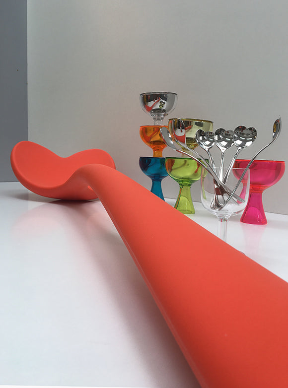Large ice cream spoon lying flat, close-up of curved handle