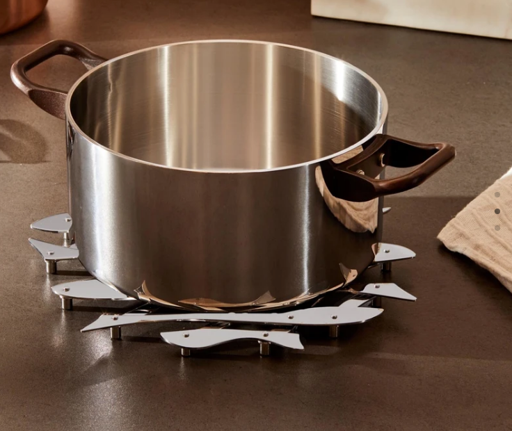 Alessi Pescher coaster under pan, unfolded into fish shape