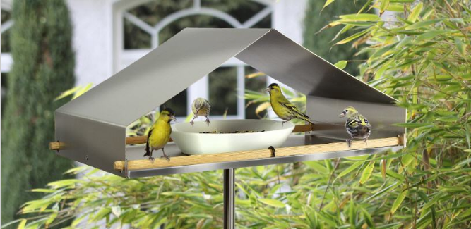 Nieuw vogel-voederhuis van Alessi-ontwerper Richard Sinnig, edelstaal, met schaal en vogels