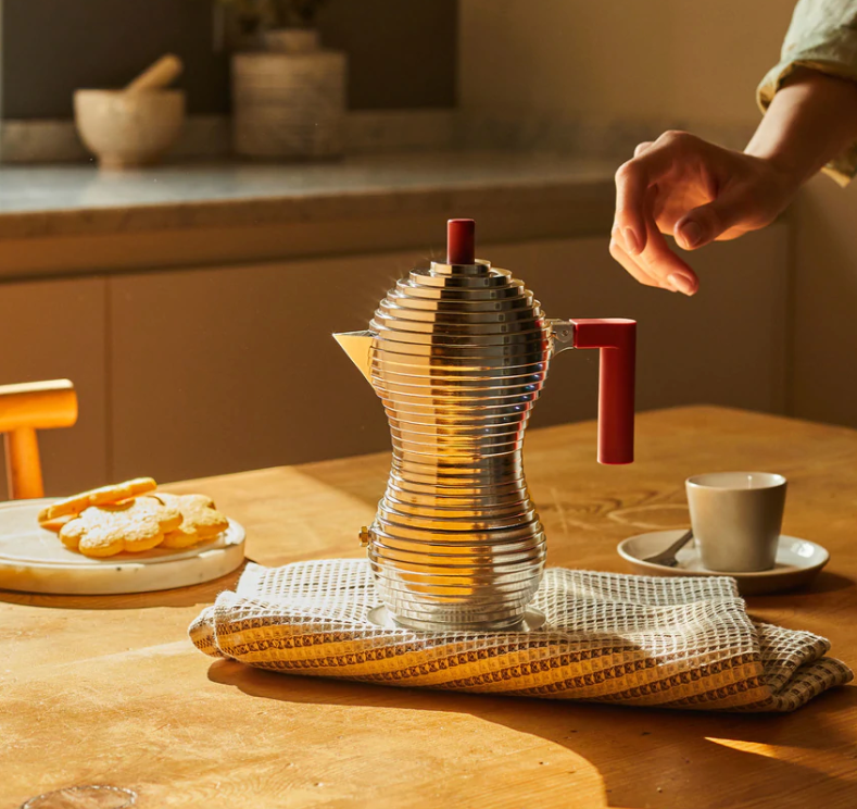 Alessi Pulcina 6-cup induction coffee maker, in use on kitchen counter