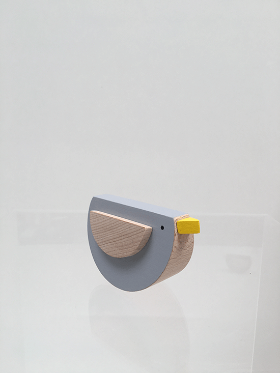 Rocking bird from KUTULU in grey, at an angle, designed by Pavla Bohácová