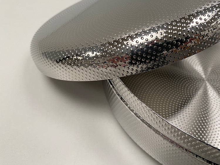 Detail of relief on lid and rim of the biscuit tin