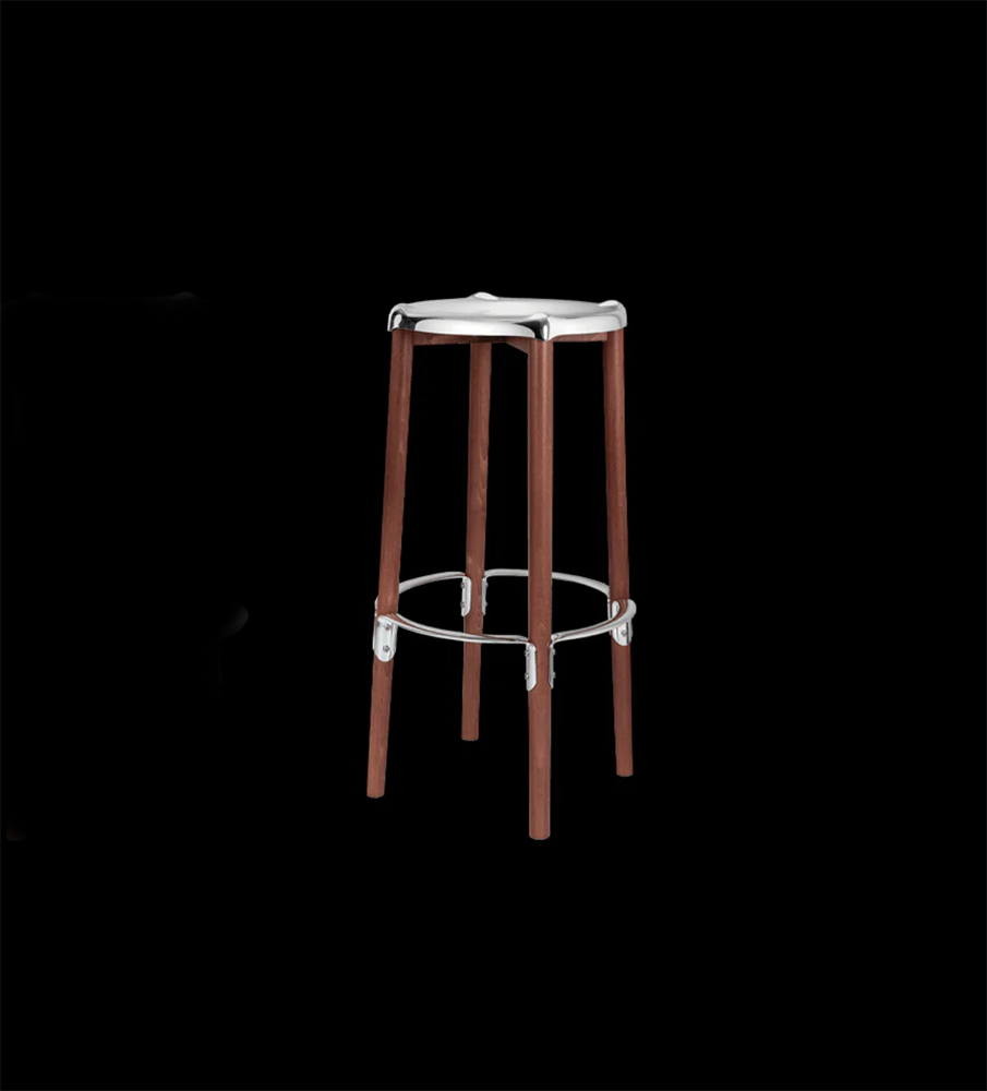 Alessi Poêle bar stool, side view with wooden legs and steel footrest ring