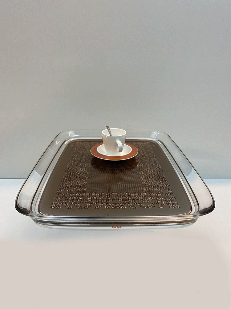 Kartell Teatime tray in bronze by Starck, with cup and saucer on top