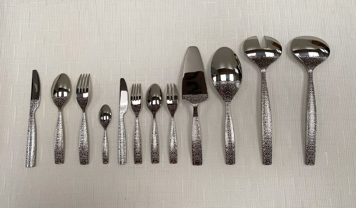 Alessi Dressed 100-delig bestek, achterkant met reliëf, ontwerp Marcel Wanders