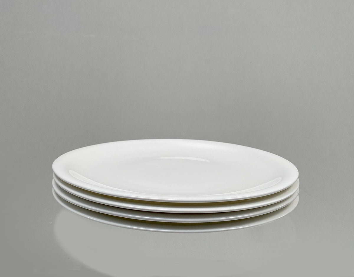 Alessi Time tableware, plates 12-piece, stack of dinner plates in cream white