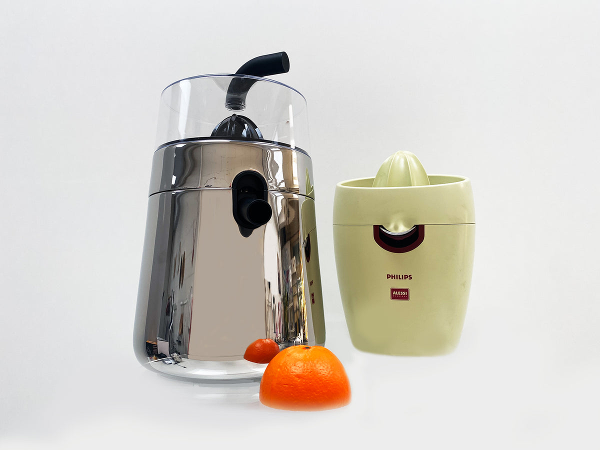 Alessi Toru electric citrus juicer next to smaller citrus juicer, size comparison