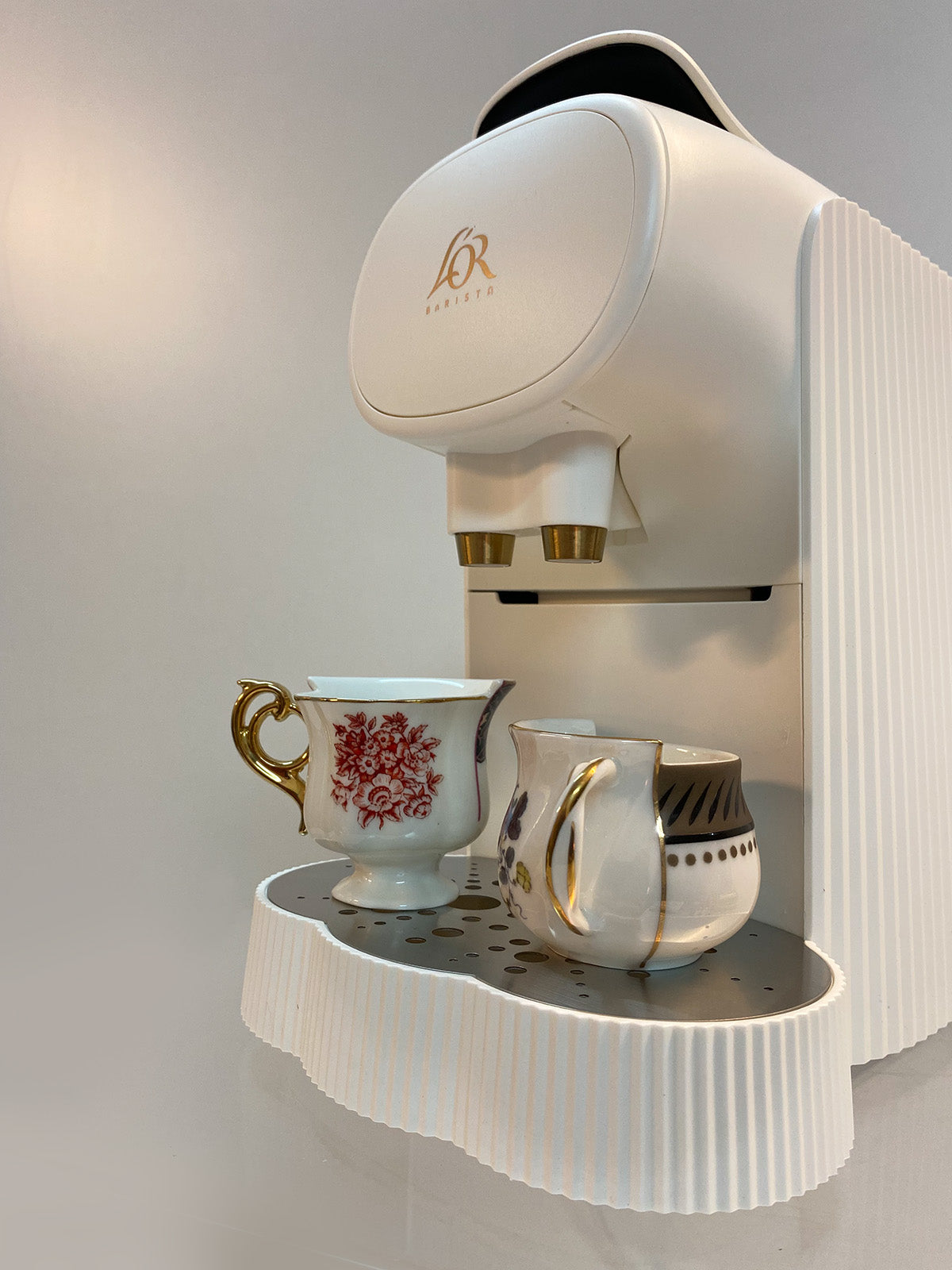 L'Or Plissé koffiemachine, detail van lekbassin en rvs uitgietpunten