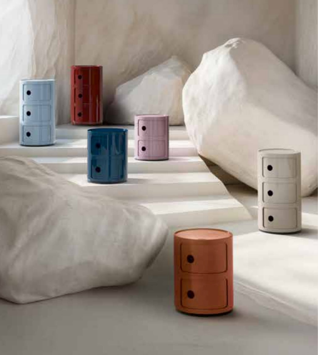 Kartell Componibili storage modules in light blue, red, pink, grey and terracotta side by side