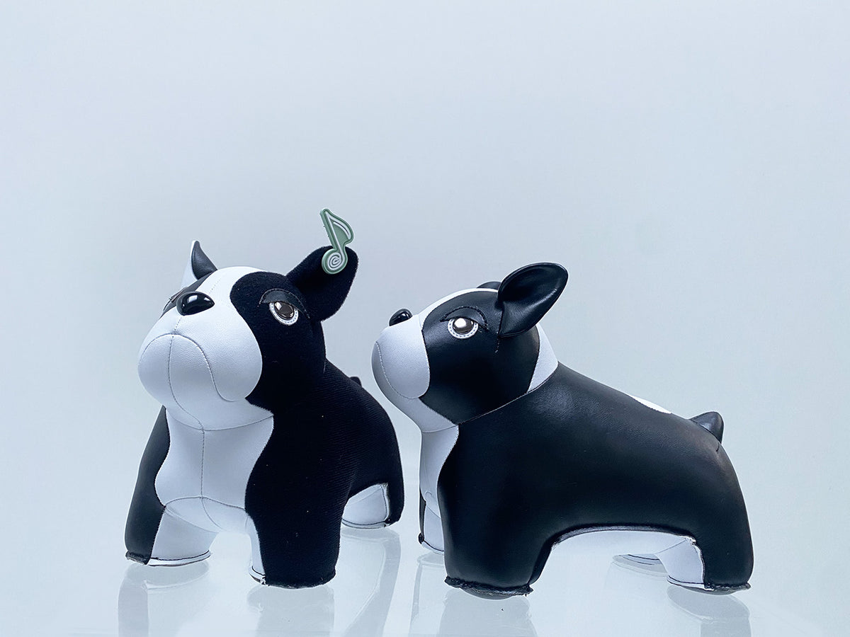 Two French Bulldog bookends side by side, one with and one without patch